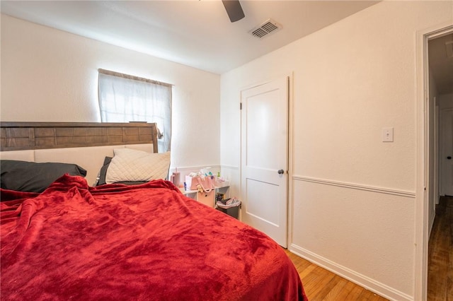 bedroom featuring ceiling fan and hardwood / wood-style flooring