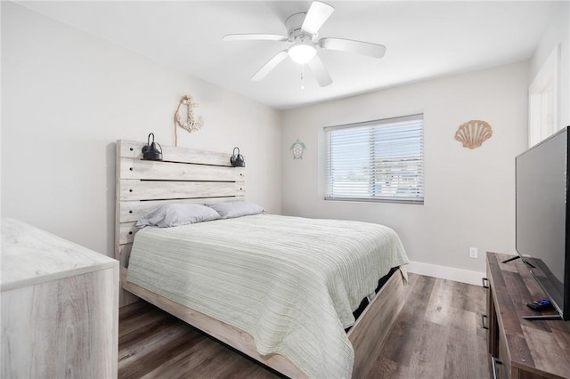 1107 E 11th St Unit H58, Port Aransas, TX 78373 - bedroom with baseboards, a ceiling fan, and wood finished floors