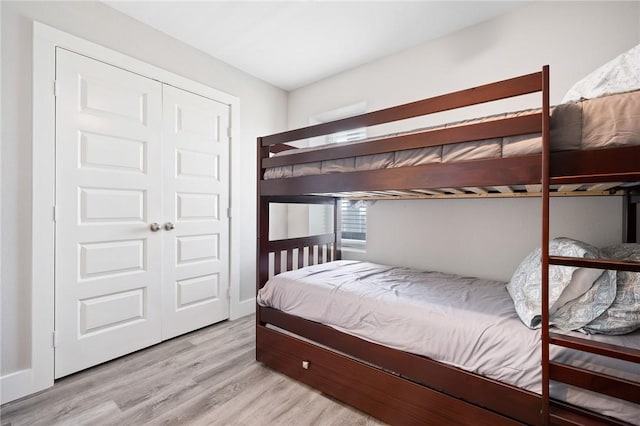 1107 E 11th St Unit H58, Port Aransas, TX 78373 - bedroom with wood finished floors and a closet