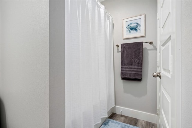 1107 E 11th St Unit H58, Port Aransas, TX 78373 - bathroom featuring wood finished floors and baseboards