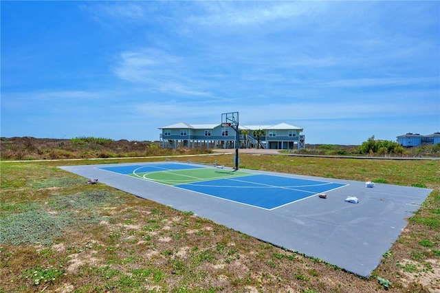 1107 E 11th St Unit H58, Port Aransas, TX 78373 - view of basketball court featuring community basketball court and a lawn