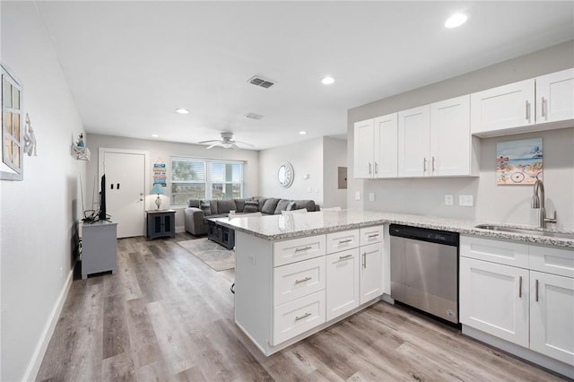 1107 E 11th St Unit H58, Port Aransas, TX 78373 - kitchen with a peninsula, a sink, visible vents, white cabinetry, and dishwasher