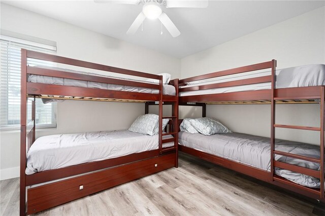1107 E 11th St Unit H58, Port Aransas, TX 78373 - bedroom with wood finished floors and ceiling fan