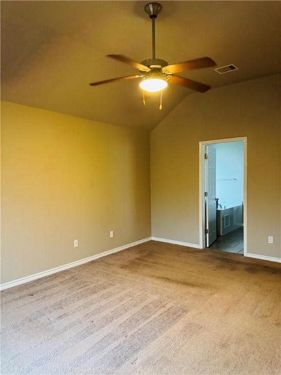 7209 Lands End Dr, Corpus Christi, TX 78414 - carpeted empty room with vaulted ceiling and ceiling fan