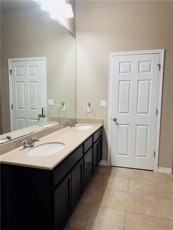 7209 Lands End Dr, Corpus Christi, TX 78414 - bathroom with double vanity and baseboards