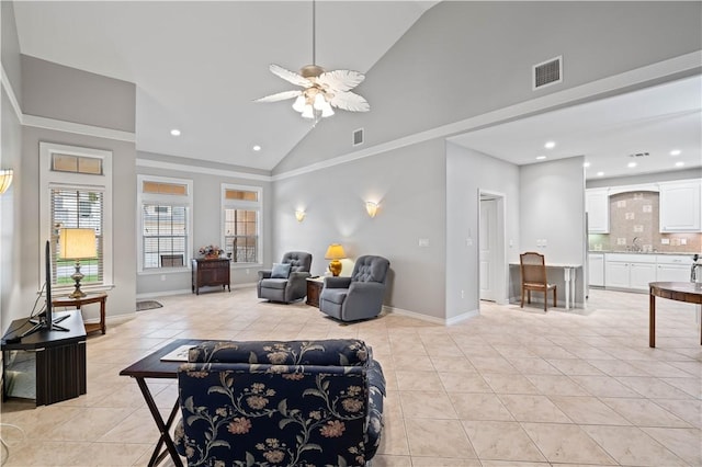 living area featuring light tile patterned floors, baseboards, visible vents, and high vaulted ceiling