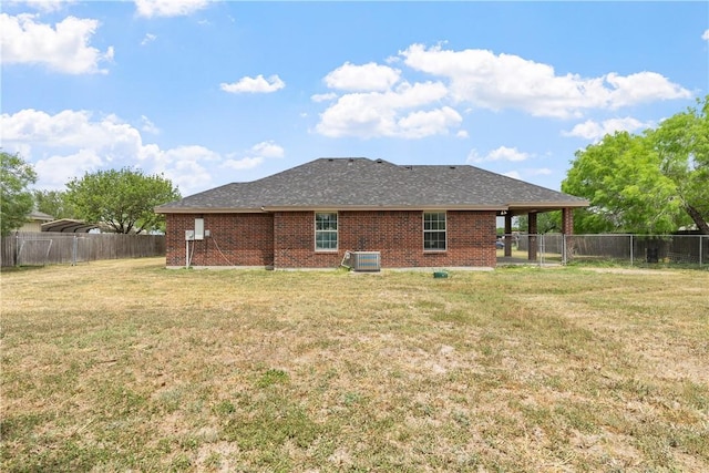 332 County Road 471, Alice, TX 78332 - rear view of property with central AC, brick siding, a fenced backyard, and a lawn