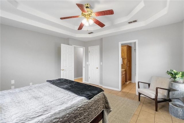 332 County Road 471, Alice, TX 78332 - bedroom featuring visible vents, a raised ceiling, ceiling fan, and light tile patterned flooring