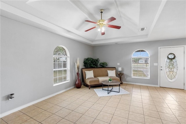 332 County Road 471, Alice, TX 78332 - living area featuring visible vents, light tile patterned floors, ceiling fan, and a tray ceiling