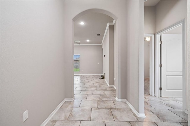 1116 Santa Catalina St, Portland, TX 78374 - hallway featuring arched walkways, crown molding, light tile patterned flooring, and recessed lighting