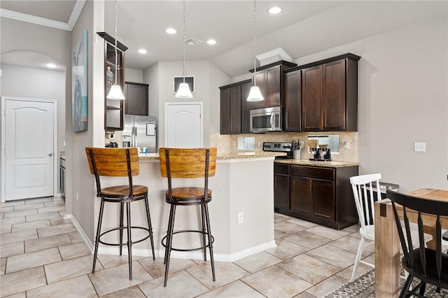 1116 Santa Catalina St, Portland, TX 78374 - kitchen featuring visible vents, dark brown cabinets, stainless steel appliances, decorative backsplash, and a breakfast bar area