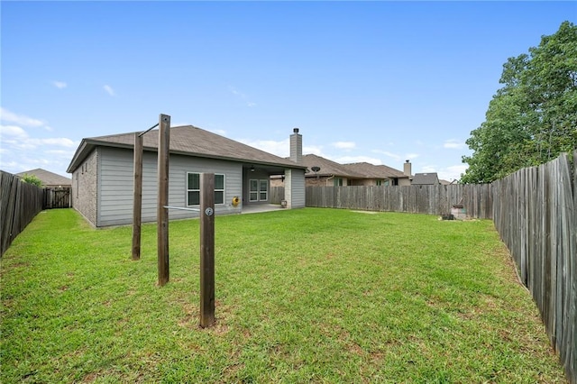 1116 Santa Catalina St, Portland, TX 78374 - rear view of house with a fenced backyard and a patio