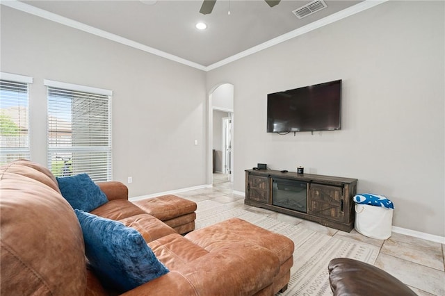 1116 Santa Catalina St, Portland, TX 78374 - tiled living room with baseboards, ornamental molding, visible vents, ceiling fan, and arched walkways