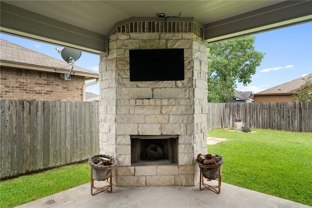 1116 Santa Catalina St, Portland, TX 78374 - fenced backyard with an outdoor stone fireplace and a patio