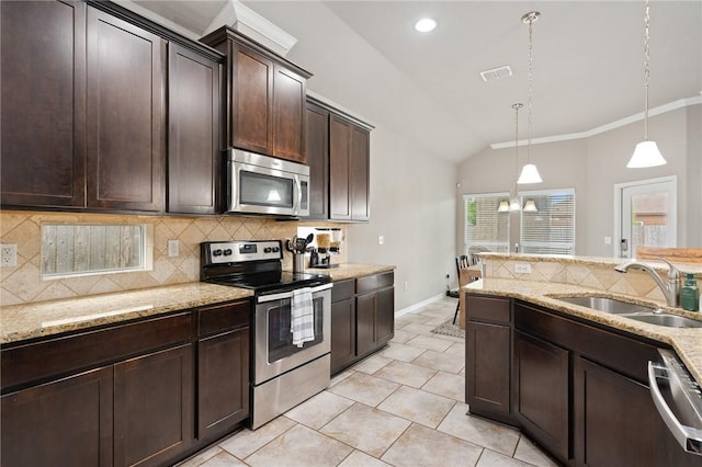 1116 Santa Catalina St, Portland, TX 78374 - kitchen featuring tasteful backsplash, dark brown cabinets, appliances with stainless steel finishes, a sink, and lofted ceiling