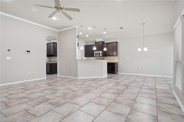 1116 Santa Catalina St, Portland, TX 78374 - unfurnished living room featuring crown molding, a ceiling fan, light tile patterned floors, a chandelier, and arched walkways