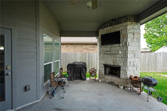 1116 Santa Catalina St, Portland, TX 78374 - view of patio / terrace with fence, an outdoor stone fireplace, and a grill