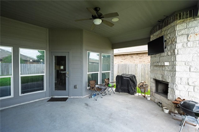 1116 Santa Catalina St, Portland, TX 78374 - view of patio / terrace featuring an outdoor stone fireplace, fence, and a ceiling fan