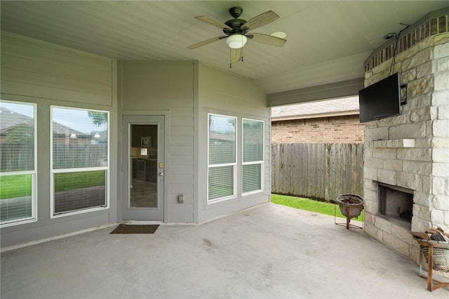 1116 Santa Catalina St, Portland, TX 78374 - view of patio / terrace with an outdoor stone fireplace and a ceiling fan