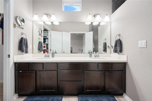 1116 Santa Catalina St, Portland, TX 78374 - bathroom featuring double vanity, baseboards, and a sink
