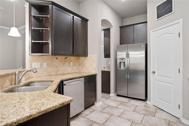 1116 Santa Catalina St, Portland, TX 78374 - kitchen featuring stainless steel fridge with ice dispenser, dishwashing machine, dark brown cabinetry, open shelves, and arched walkways
