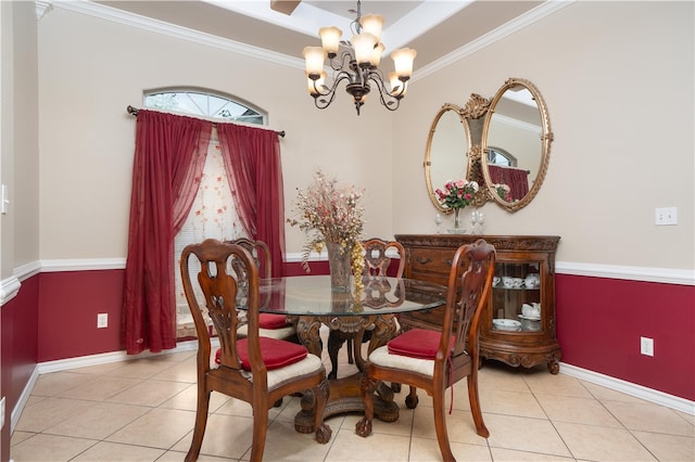 tiled dining room with a chandelier and crown molding