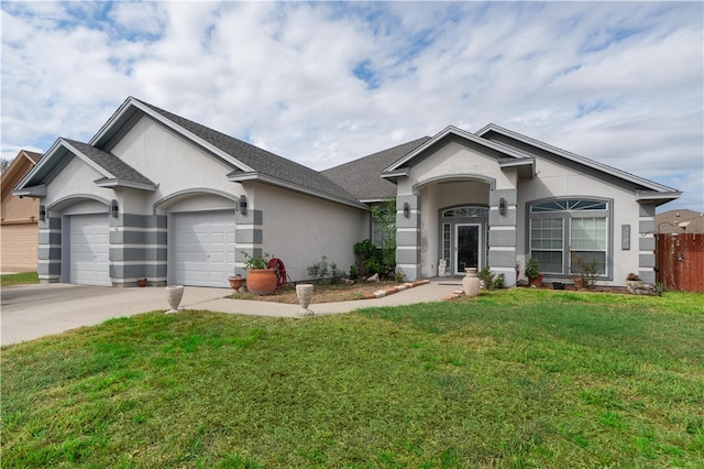 single story home with a garage and a front lawn