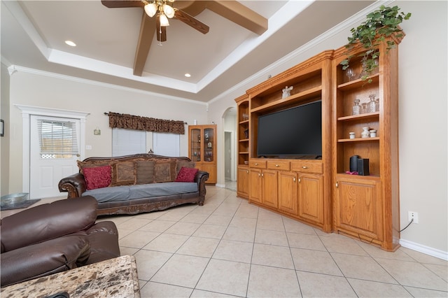 living room featuring ceiling fan, a raised ceiling, light tile patterned flooring, and crown molding