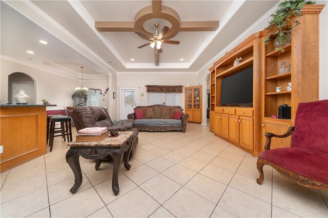 tiled living room featuring crown molding, ceiling fan, and a raised ceiling