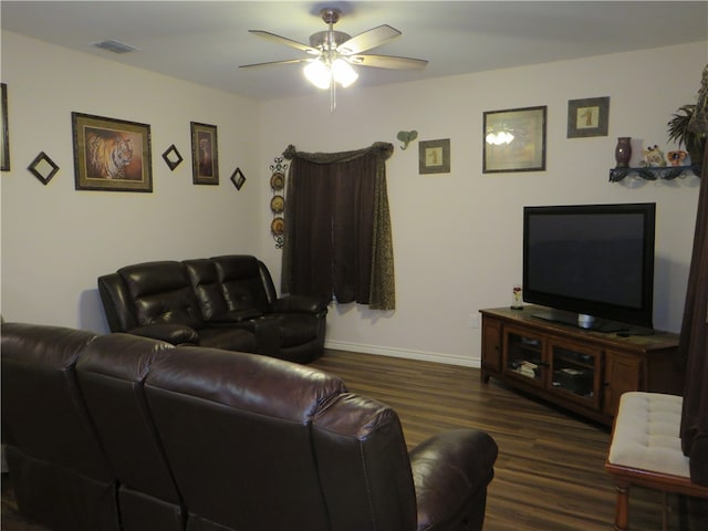 living room with ceiling fan and dark hardwood / wood-style floors