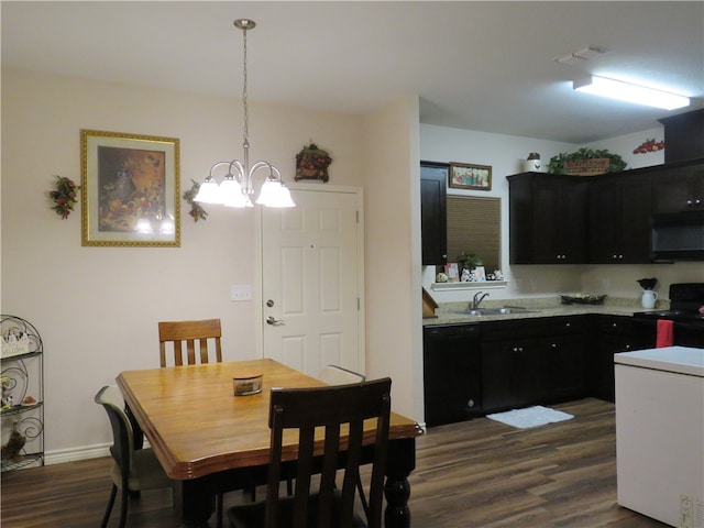 dining room featuring dark hardwood / wood-style floors and sink