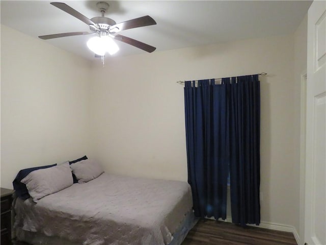 2735 Beaumont Ave, Ingleside, TX 78362 - bedroom with dark wood finished floors and ceiling fan