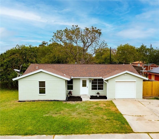 ranch-style house with a front yard and a garage