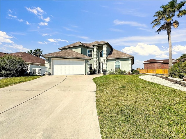 mediterranean / spanish house featuring a garage, fence, concrete driveway, stucco siding, and a front lawn