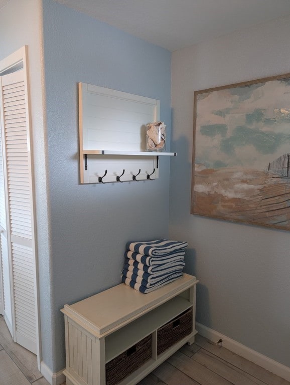 mudroom with light hardwood / wood-style flooring