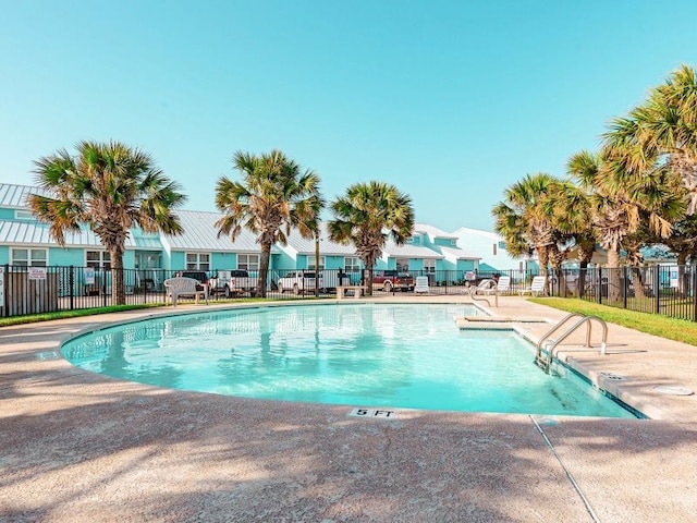 view of swimming pool with a patio