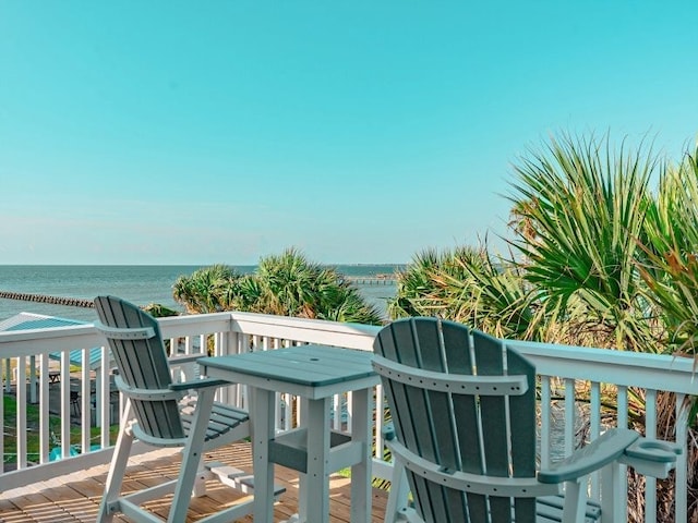 balcony featuring a deck with water view