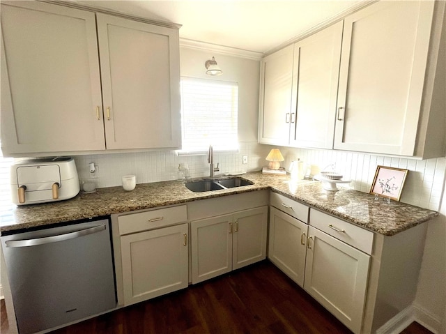 kitchen featuring decorative backsplash, sink, stainless steel dishwasher, and dark hardwood / wood-style floors