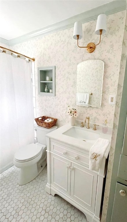 bathroom featuring vanity, a shower with curtain, tile patterned flooring, toilet, and ornamental molding