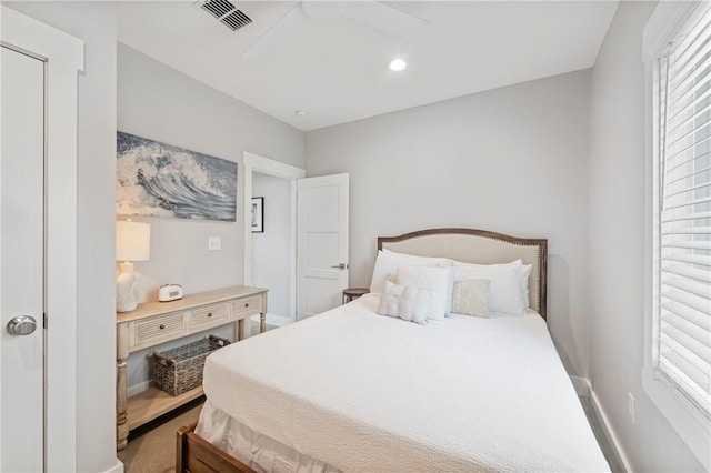 bedroom with multiple windows, recessed lighting, baseboards, and a ceiling fan