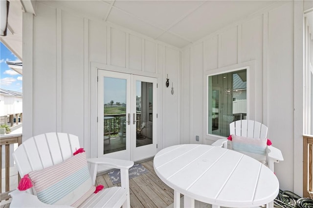 deck with french doors and outdoor dining space