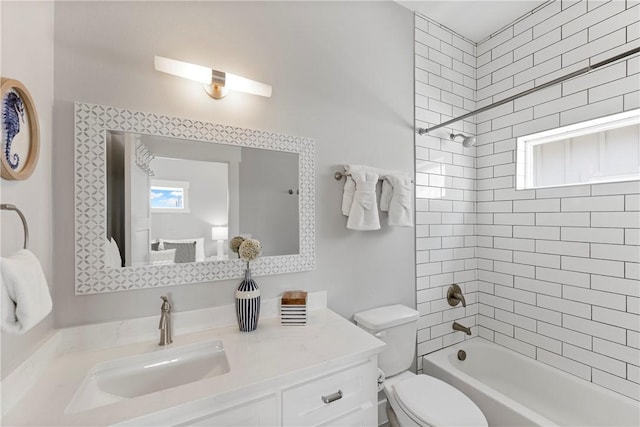 bathroom with toilet, vanity, and bathtub / shower combination