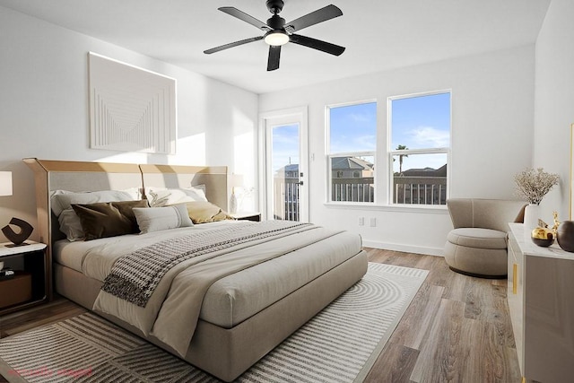 bedroom with light wood-type flooring, a ceiling fan, and baseboards