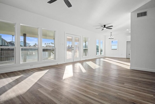 kitchen featuring a kitchen island, white cabinets, and decorative light fixtures