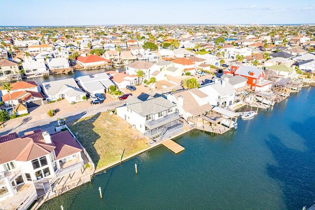 birds eye view of property with a water view and a residential view