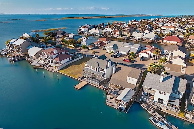 aerial view of residential area with a large body of water