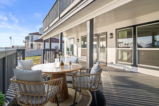 wooden terrace featuring outdoor dining area