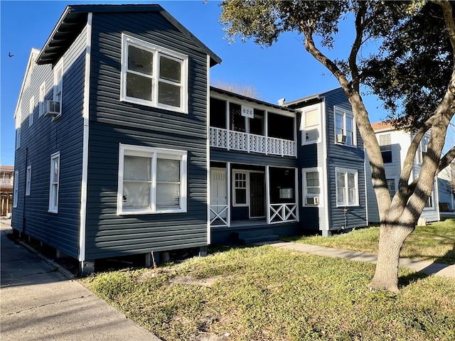 view of front of house with a balcony