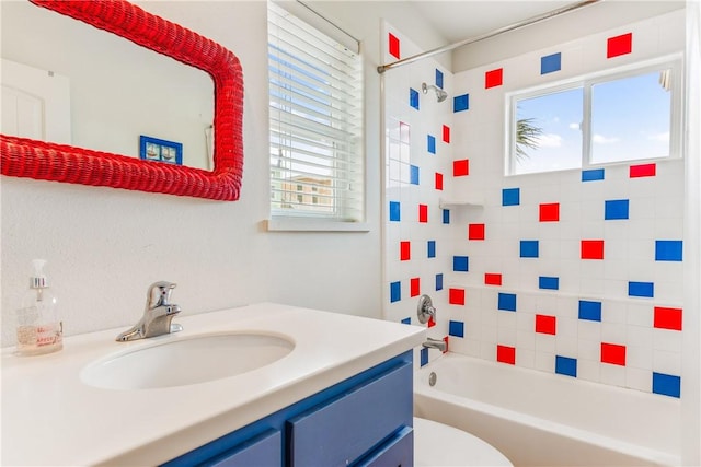 full bathroom featuring a wealth of natural light, toilet, vanity, and bathtub / shower combination