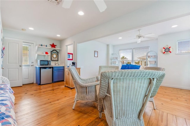 kitchen with ceiling fan, appliances with stainless steel finishes, light wood-style flooring, and recessed lighting